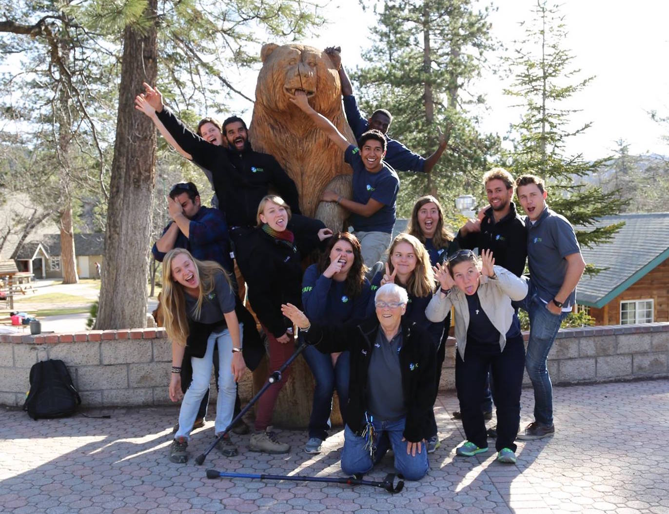 summer seasonal camp staff pose outside